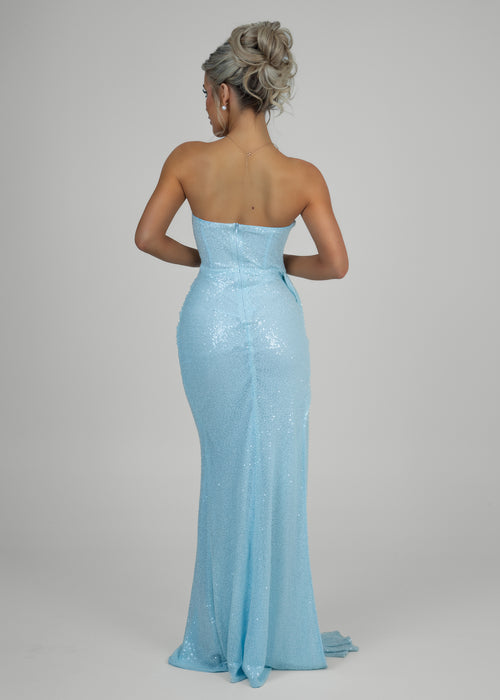 Women's baby blue embellished ball gown back view with zip up back and elegant trail. 