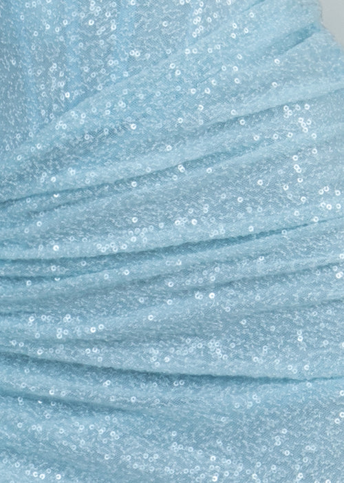 Close up fabric swatch of baby blue sequin fabric with ruching detail. 
