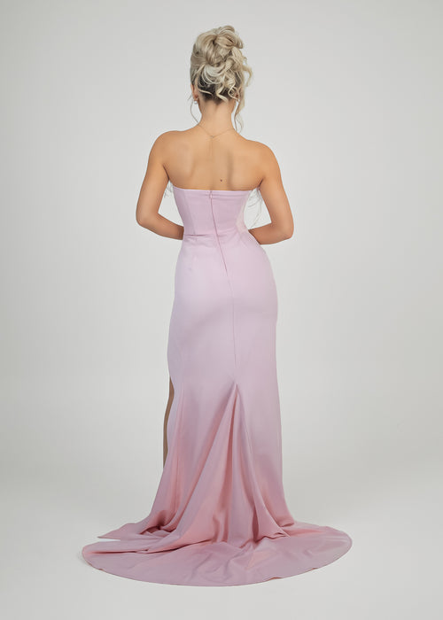 Women's pink prom gown with strapless design and zip up centre of back. 