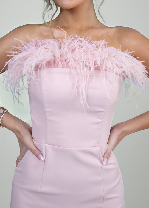 Women's pink feather ball gown close up of details and fit. 