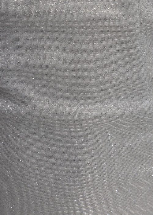 Women's silver sparkly mini dress with halter neckline and bodycon fit. Model is 5ft2' and wears a size XS 6.