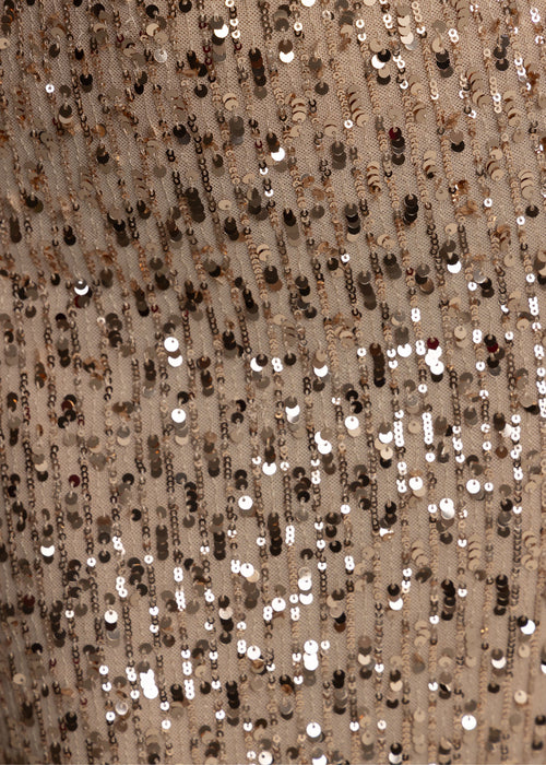 Close up swatch of embellished fabric with rose gold sequins patterns.