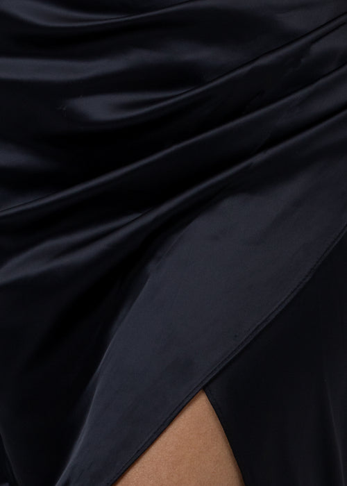 Close up fabric swatch of black satin material for ball gown.