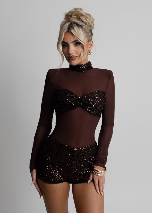 Women's brown sheer long sleeve playsuit with embellished bust and fully embellished shorts. Embellished with brown sparkly sequins and bodycon fit. Model is 5ft2' and wears a size XS 6
