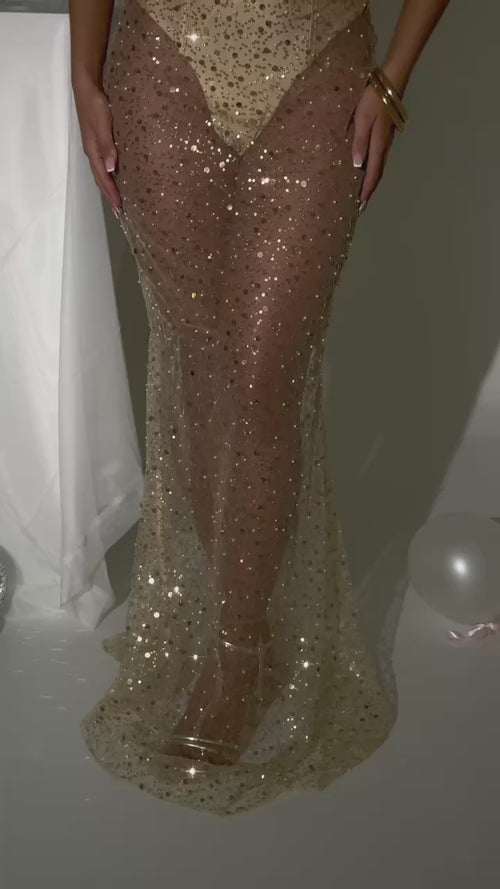 Women's gold sequin and beaded maxi dress with built in bodysuit and sheer maxi skirt fully embellished. Figure hugging fit, strapless style and built in cups. Model is 5ft2' and wears a size XS 6.